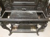 a bench that has a marble on it in the middle of a room
