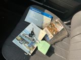 a car seat with a bunch of items on it