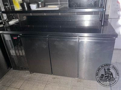 a stainless steel kitchen with a microwave and dishwasher