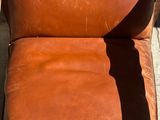an image of a brown leather chair sitting on top of a wooden floor