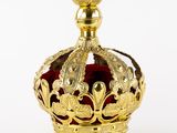 a gold crown on a white background with a red background