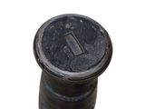 a close up picture of a black screw on a white background