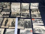 several old black and white photographs of people and animals on a table