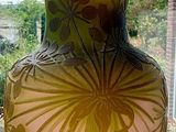 a vase that is sitting on a window sill