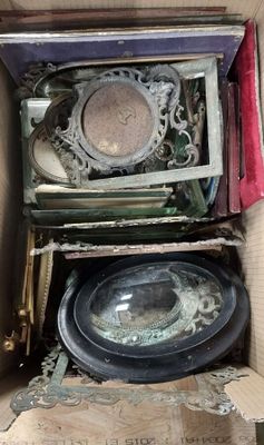 a cardboard box filled with assorted items in it