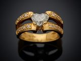 a close up of a diamond ring on a black surface