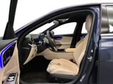 the interior of a car with the door open and the driver ' s seat down