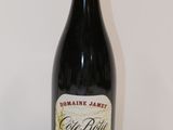 a bottle of wine that is sitting on a table