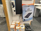 a display of electronic devices on a shelf in a store