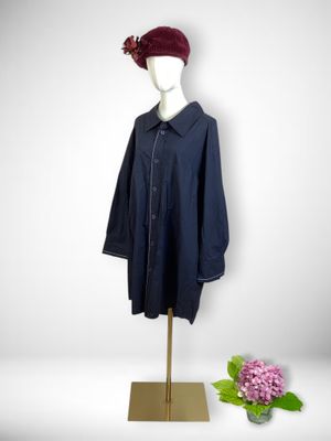 navy blue shirt dress with red hat on mannequin base
