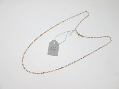 gros plan d'un collier auquel est attachée une étiquette