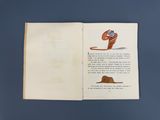 un livre ouvert sur lequel figure l'image d'un chapeau