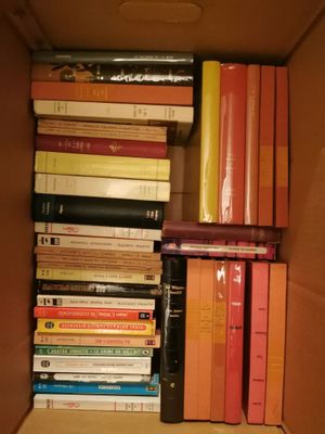 a box full of books sitting on the floor
