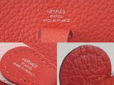 a close up of the inside of a red leather purse