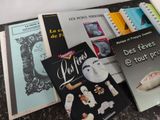 many books that are sitting on a table