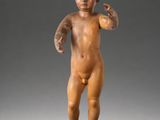 an image of a small statue of a child on a black base