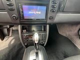the interior of a car with a steering control and dashboard controls