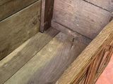 a wooden chest with a metal latch on it