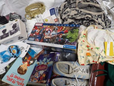 a lot of items that are laying out on the bed