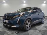 a blue car parked on a checkered floor in a garage