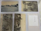 an open suitcase with a bunch of old photos inside of it