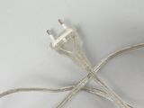 a white cord that is connected to an electrical plug
