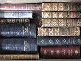 a box full of old books sitting on the floor