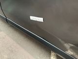 a sticker on the side of a car that is parked in a parking lot