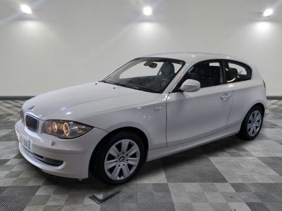 a picture of a white car parked in a garage