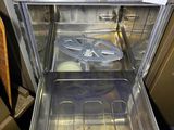 a silver oven with a metal tray inside of it