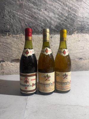 three bottles of wine sitting next to each other on a table