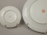 two plates that are sitting next to each other on a table
