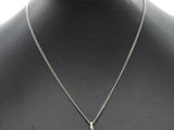 a close up of a necklace on a mannequin mannequin