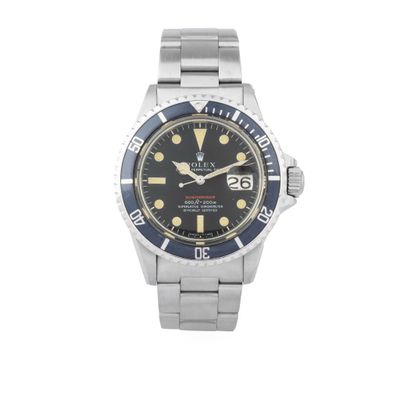 a watch with a black dial and yellow hands on a bracelet