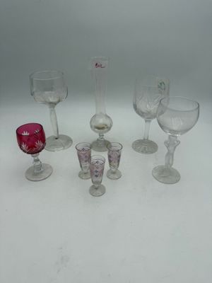 a lot of wine glasses that are sitting on a table