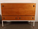 an image of a wooden chest of drawers in a room