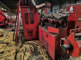 a red machine that is sitting inside of a building