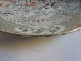 a plate with a design on it sitting on a table
