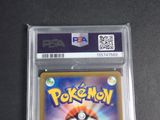a close up of a pokemon card in a plastic case