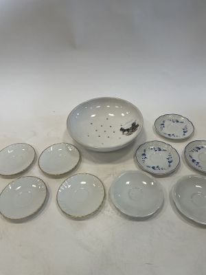 a lot of plates that are sitting on a table
