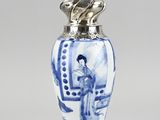 an image of a blue and white vase with a woman on it