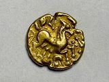 an image of a gold coin with an image of a bird on it