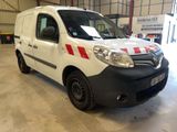 a white van with red stripes parked inside of a building