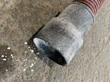 a pipe that is leaking water out of the ground