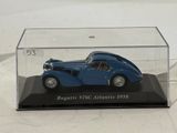 a blue model of a car in a clear case