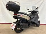 a picture of a motorcycle parked in a garage