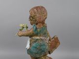 statue of a boy with a flower in his hand
