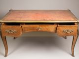 a small desk with two drawers on top of it