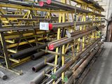 a large pile of pipes and pipes in a warehouse