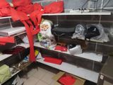 a shelf full of christmas decorations in a kitchen